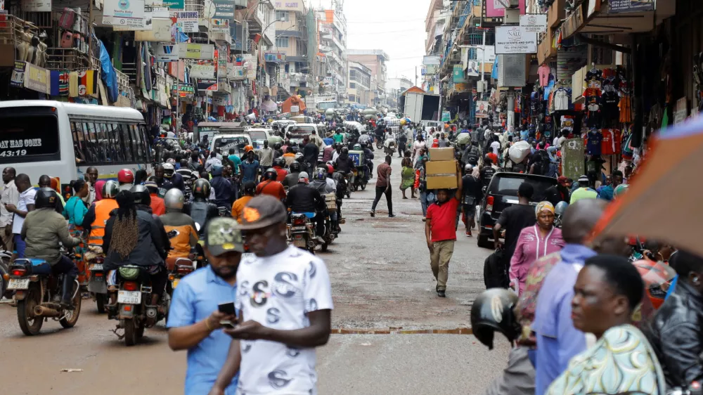 Motorcycle taxis carry passengers following a resurgence of Ebola involving the Bundibugyo strain, a rare variant of the virus with no approved vaccine currently available, along Ben Kiwanuka street in Kampala, Uganda May 21, 2026. REUTERS/Abubaker Lubowa