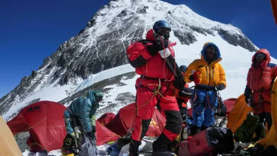 Mount Everest on the backdrop as members of an expedition team prepare to ascend the mountain, at Camp 4 in the Solukhumbu district, also known as the Everest region, Nepal, May 21, 2026. REUTERS/Purnima Shrestha