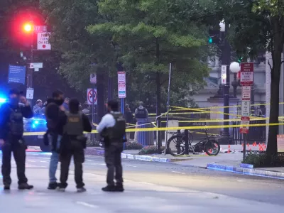 U.S. Secret Service Police are seen on a crime scene after responding to reports of shots fired near the White House, Saturday, May 23, 2026, in Washington. (AP Photo/Alex Brandon)