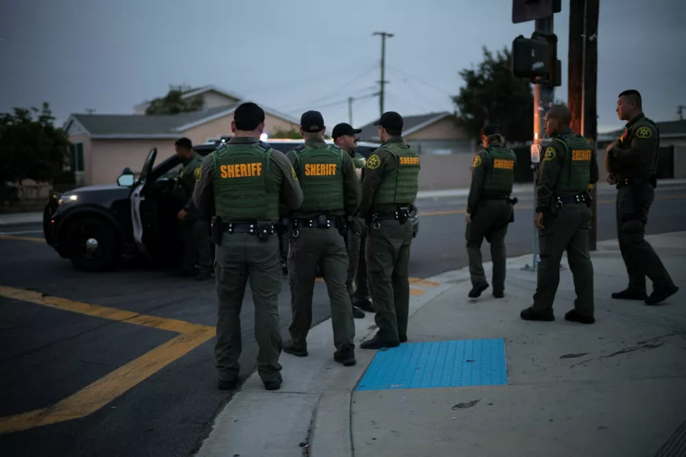 Law enforcement officers stand near an evacuation zone, after residents were ordered to evacuate because of a failing tank containing methyl methacrylate, a flammable liquid used in the aerospace industry, in Stanton, California, U.S., May 23, 2026, REUTERS/Ed Ou