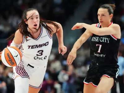 Toronto Tempo's Marina Mabrey (3) drives past Portland Fire's Teja Oblak (7) during the second half of a WNBA basketball game in Toronto, Saturday May 23, 2026. (Frank Gunn/The Canadian Press via AP)
