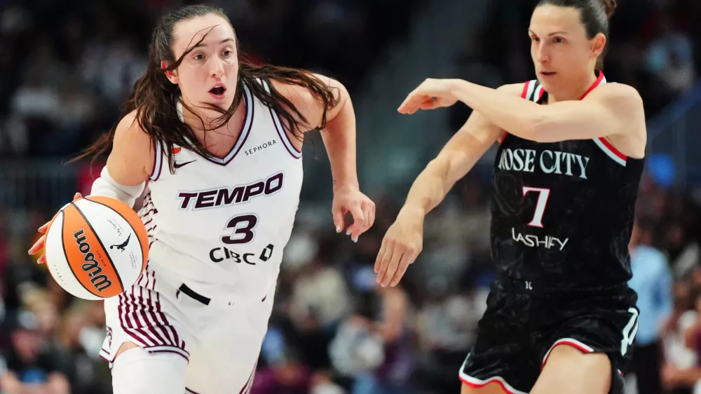 Toronto Tempo's Marina Mabrey (3) drives past Portland Fire's Teja Oblak (7) during the second half of a WNBA basketball game in Toronto, Saturday May 23, 2026. (Frank Gunn/The Canadian Press via AP)