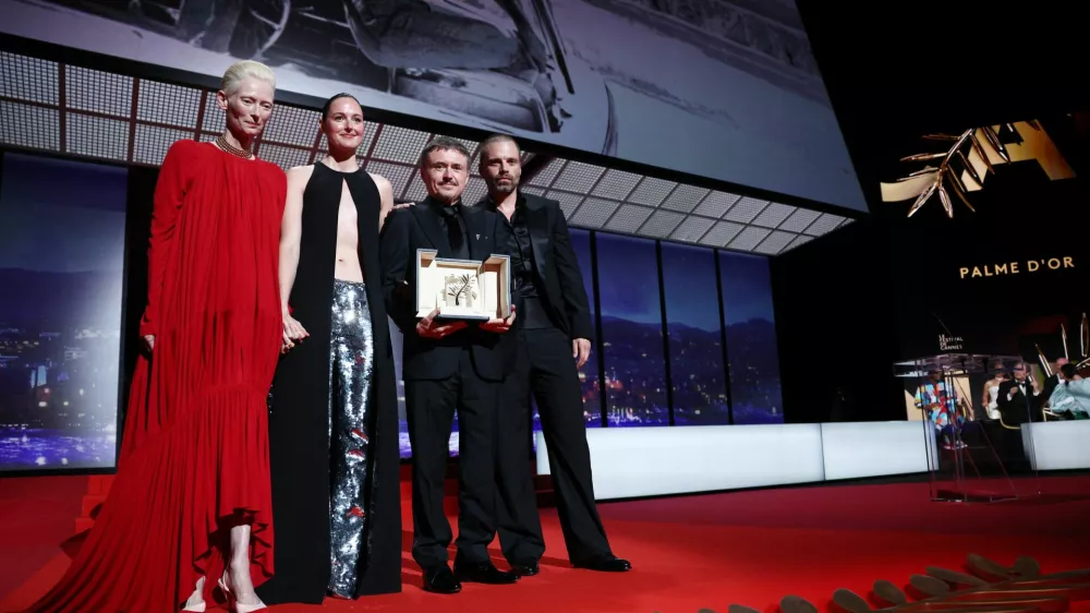 Tilda Swinton and cast members Sebastian Stan and Renate Reinsve pose with director Cristian Mungiu, Palme d'Or award winner for the film "Fjord" during the closing ceremony of the 79th Cannes Film Festival in Cannes, France, May 23, 2026. REUTERS/Marko Djurica