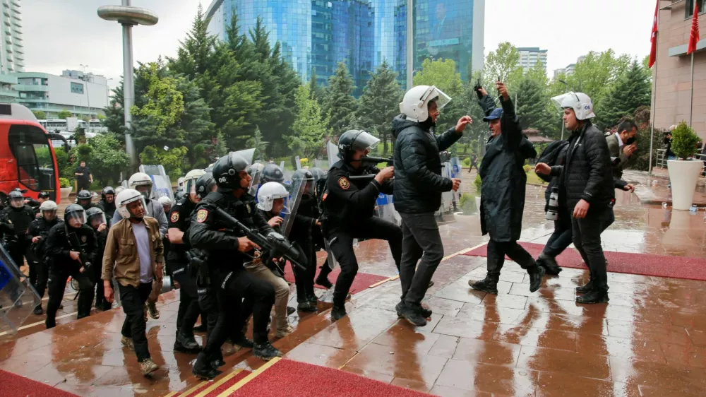 Turkish riot police enter the headquarters of the main opposition Republican People's Party (CHP) to evict its ousted leadership, after authorities ordered enforcement of a court ruling removing the party's leadership from the building, in Ankara, Turkey, May 24, 2026. REUTERS/Efekan Akyuz   TPX IMAGES OF THE DAY