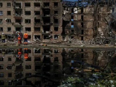 Communal workers clean an area at the site of a Russian missile and drone strike, amid Russia's attack on Ukraine, in Kyiv, Ukraine May 24, 2026. REUTERS/Viacheslav Ratynskyi