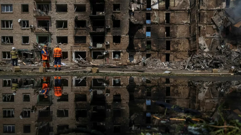 Communal workers clean an area at the site of a Russian missile and drone strike, amid Russia's attack on Ukraine, in Kyiv, Ukraine May 24, 2026. REUTERS/Viacheslav Ratynskyi