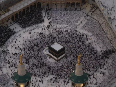 Muslim pilgrims circumambulate the Kaaba, Islam's holiest site, at the Grand Mosque, during the annual Hajj pilgrimage in Mecca, Saudi Arabia, Sunday, May 24, 2026. (AP Photo/Altaf Qadri)