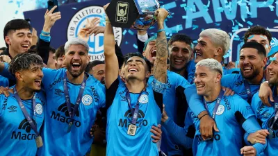 Soccer Football - Argentina Primera Division - Torneo Apertura - Final - River Plate v Belgrano - Mario Alberto Kempes Stadium, Cordoba, Argentina - May 24, 2026 Belgrano's Lucas Zelarayan lifts the trophy as he celebrates with teammates after winning the Torneo Apertura REUTERS/Agustin Marcarian   TPX IMAGES OF THE DAY