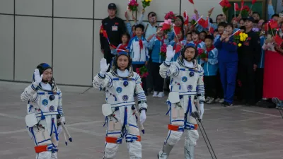 Astronaut for the Shenzhou 23 manned mission from left Hong Kong's Lai Ka-ying, identified by Chinese authorities as Li Jiaying using the Mandarin transliteration of the name, China's Zhu Yangzhu and Zhang Zhiyuan wave as they attend a see-off ceremony for their manned space mission at the Jiuquan Satellite Launch Center in northwestern China, Sunday, May 24, 2026. (AP Photo/Ng Han Guan)