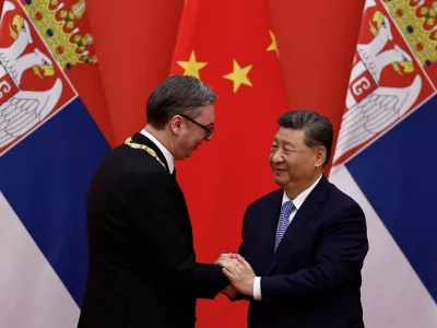 Chinese President Xi Jinping greets Serbian President Aleksandar Vucic after he received the Friendship Medal of the People's Republic of China, at the Great Hall of the People, in Beijing, China May 25, 2026. REUTERS/Tingshu Wang/Pool