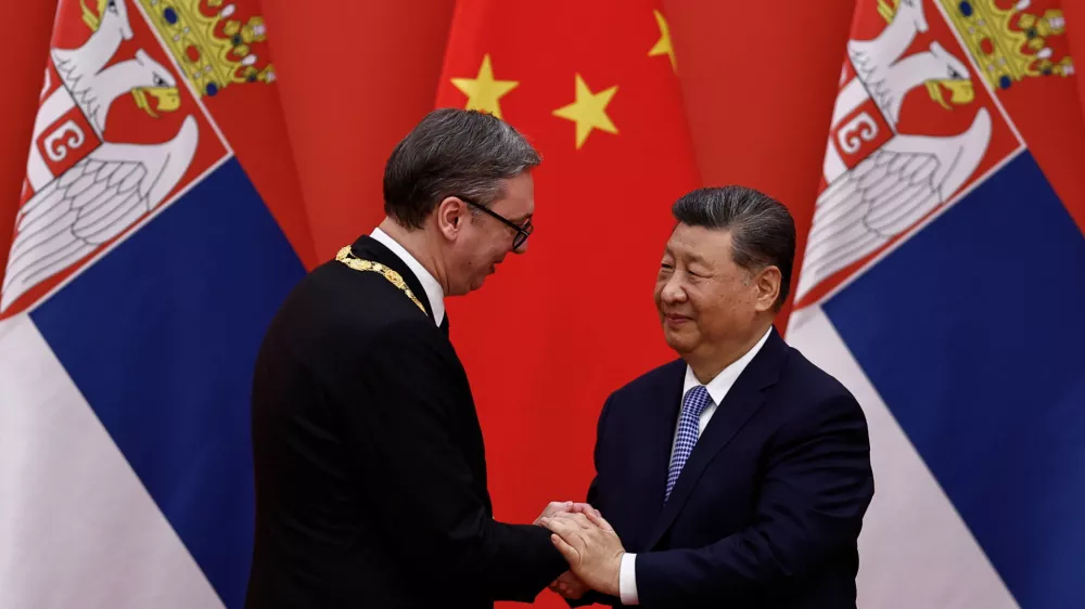 Chinese President Xi Jinping greets Serbian President Aleksandar Vucic after he received the Friendship Medal of the People's Republic of China, at the Great Hall of the People, in Beijing, China May 25, 2026. REUTERS/Tingshu Wang/Pool