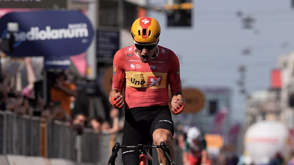 Norway's Fredrik Dversnes Lavik celebrates winning the 15th stage of the Giro d'Italia cycling race, from Voghera to Milan, Italy, Sunday, May 24, 2026. (Marco Alpozzi/LaPresse via AP)