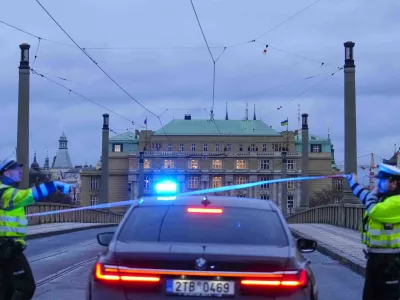 Police officers guard a street in downtown Prague, Czech Republic, Thursday, Dec. 21, 2023. Czech police say a shooting in downtown Prague has killed an unspecified number of people and wounded others. (AP Photo/Petr David Josek)