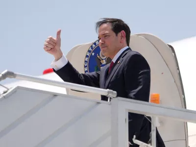 U.S. Secretary of State Marco Rubio gestures as he boards his plane at Indira Gandhi International Airport in New Delhi, India, Tuesday, May 26, 2026.   Julia Demaree Nikhinson/Pool via REUTERS