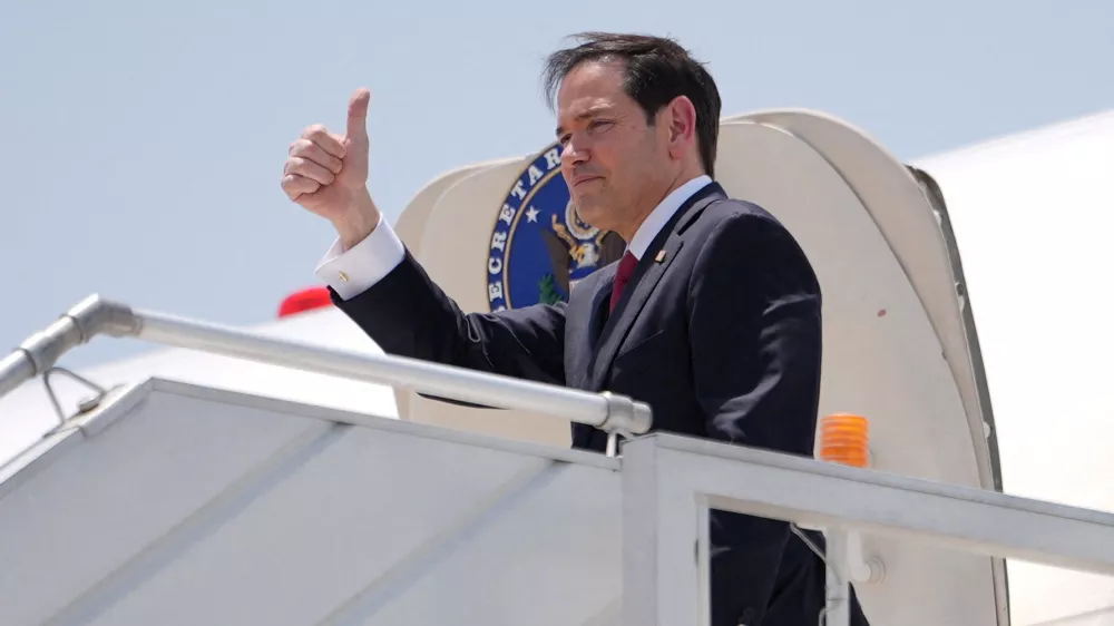 U.S. Secretary of State Marco Rubio gestures as he boards his plane at Indira Gandhi International Airport in New Delhi, India, Tuesday, May 26, 2026.   Julia Demaree Nikhinson/Pool via REUTERS