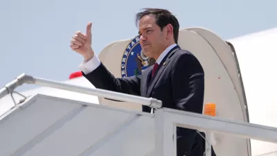 U.S. Secretary of State Marco Rubio gestures as he boards his plane at Indira Gandhi International Airport in New Delhi, India, Tuesday, May 26, 2026.   Julia Demaree Nikhinson/Pool via REUTERS