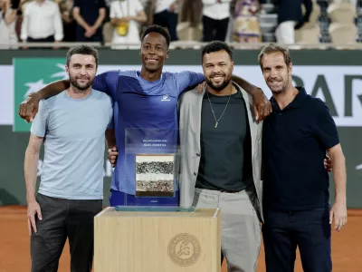 Tennis - French Open - Roland Garros, Paris, France - May 25, 2026 France's Gael Monfils poses with former tennis players Gilles Simon, Jo-Wilfried Tsonga and Richard Gasquet after receiving an award from Roland Garros after losing his first round match against France's Hugo Gaston REUTERS/Benoit Tessier