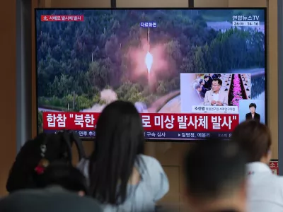 A TV screen shows a reporting of North Korea's unidentified projectile, with file footage during a news program at the Seoul Railway Station in Seoul, South Korea, Tuesday, May 26, 2026. (AP Photo/Lee Jin-man)