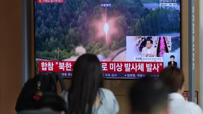 A TV screen shows a reporting of North Korea's unidentified projectile, with file footage during a news program at the Seoul Railway Station in Seoul, South Korea, Tuesday, May 26, 2026. (AP Photo/Lee Jin-man)
