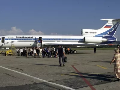 ** FILE ** Passengers get aboard a Sibir Airline Tu-154 at Sochi airport, Southern Russia, in this Oct. 8, 2001 file photo. A similar Tu-154 airliner went missing near Rostov-on-Don, about 965 km (600 miles) south of Moscow, Tuesday, Aug. 24, 2004. ITAR-Tass reported that the Tu-154 had crashed. The plane belonged to the Russian airline Sibir, which said it disappeared from radar screens at about 11:00 p.m. Tuesday, Interfax reported. (AP Photo/Ivan Sekretarev, File)