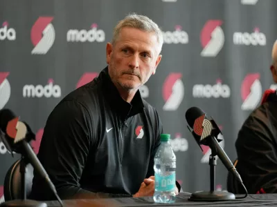 Portland Trail Blazers new owner and governor Tom Dundon listens during a news conference on Thursday, April 2, 2026, in Portland, Ore. (AP Photo/Jenny Kane)