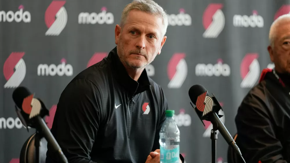 Portland Trail Blazers new owner and governor Tom Dundon listens during a news conference on Thursday, April 2, 2026, in Portland, Ore. (AP Photo/Jenny Kane)