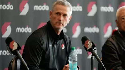 Portland Trail Blazers new owner and governor Tom Dundon listens during a news conference on Thursday, April 2, 2026, in Portland, Ore. (AP Photo/Jenny Kane)