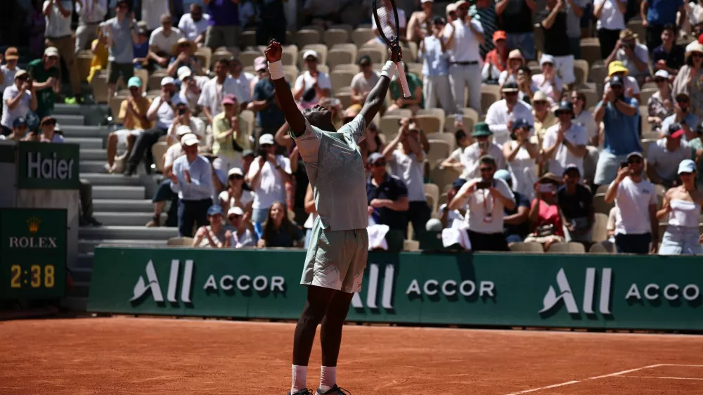 Tennis - French Open - Roland Garros, Paris, France - May 26, 2026 France's Moise Kouame celebrates after winning his first round match against Croatia's Marin Cilic REUTERS/Guglielmo Mangiapane