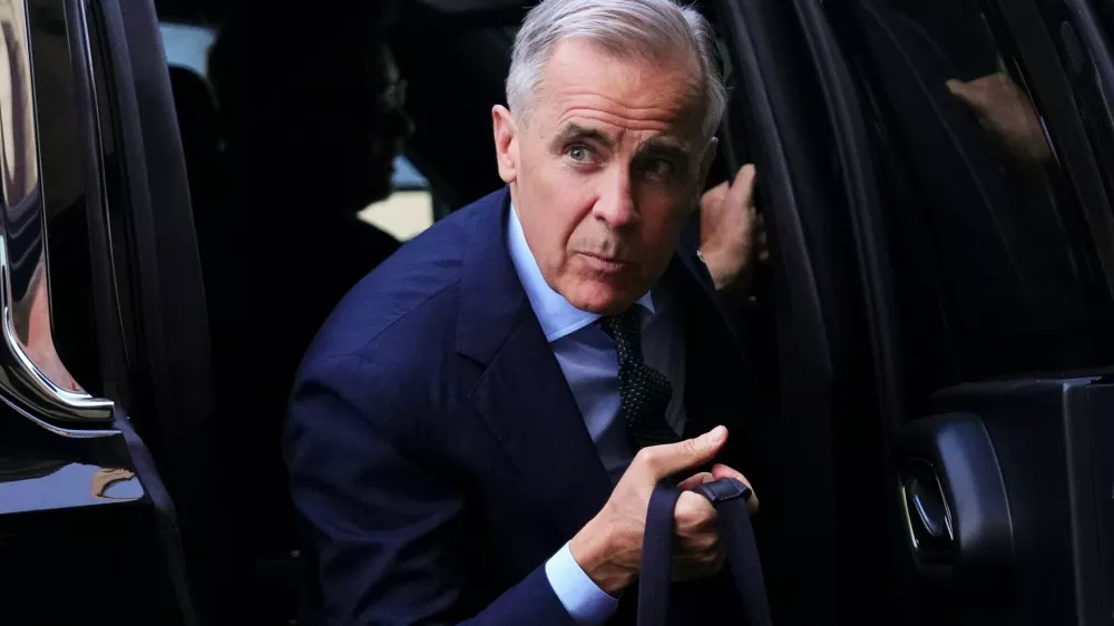 Canadian Prime Minister Mark Carney arrives to Parliament Hill in Ottawa on Tuesday, May 26, 2026. (Sean Kilpatrick/The Canadian Press via AP)