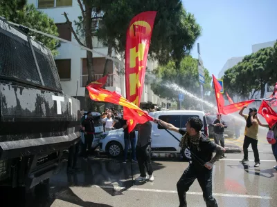 Police use a water cannon during a rally to disperse supporters of Ozgur Ozel, the ousted chairman of the main opposition Republican People's Party (CHP), while waiting for his arrival in Izmir, Turkey, May 26, 2026. REUTERS/Berkcan Zengin