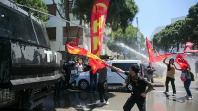 Police use a water cannon during a rally to disperse supporters of Ozgur Ozel, the ousted chairman of the main opposition Republican People's Party (CHP), while waiting for his arrival in Izmir, Turkey, May 26, 2026. REUTERS/Berkcan Zengin