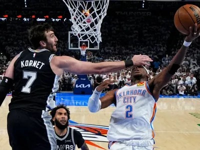 Oklahoma City Thunder guard Shai Gilgeous-Alexander (2) shoots against San Antonio Spurs center Luke Kornet (7) in the second half of Game 5 in the Western Conference finals NBA basketball playoffs series, Tuesday, May 26, 2026, in Oklahoma City. (AP Photo/Julio Cortez)