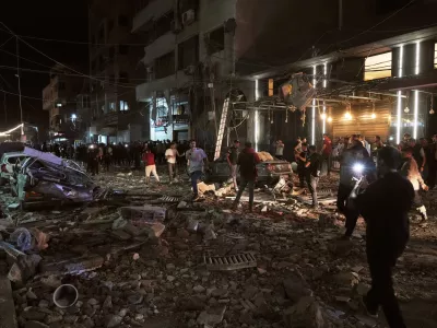 Palestinians inspect the site of an Israeli airstrike in Gaza City Tuesday, May 26, 2026. (AP Photo/Jehad Alshrafi)