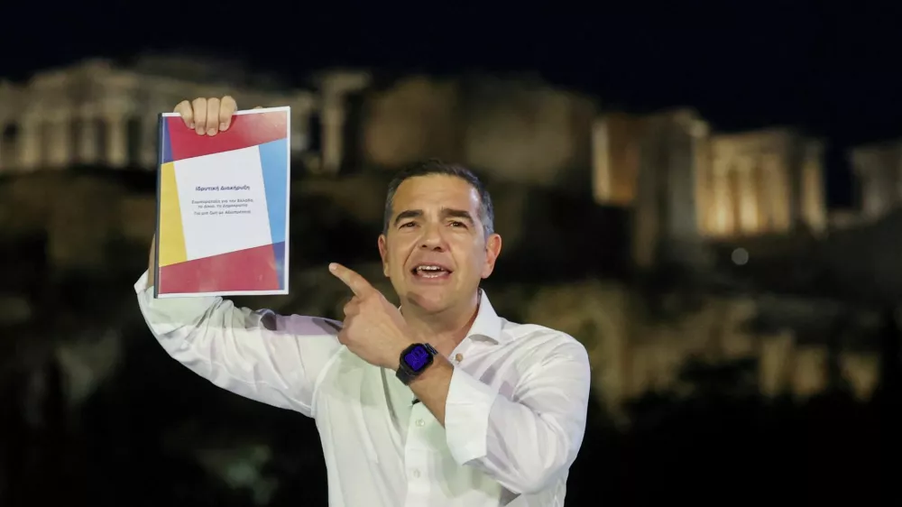 Greece's former Prime Minister Alexis Tsipras holds the founding declaration, during the official announcement of his new political party, ahead of the 2027 parliamentary elections, in Athens, Greece, May 26, 2026. REUTERS/Louisa Gouliamaki
