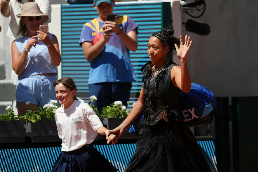 Naomi Osaka of Japan enters the court for the first round women's singles tennis match against Laura Siegemund of Germany at the French Open tennis tournament in Paris, Tuesday, May 26, 2026. (AP Photo/Aurelien Morissard)
