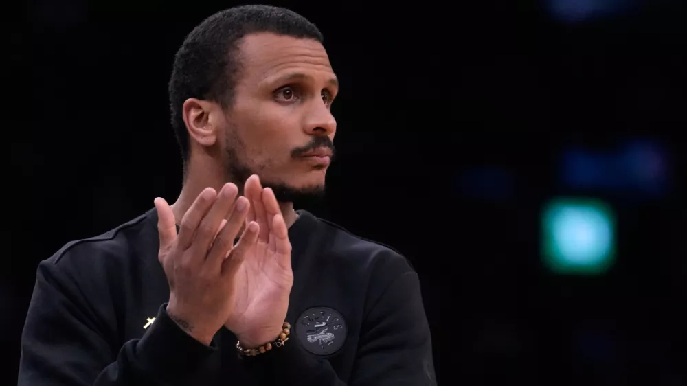 Boston Celtics head coach Joe Mazzulla applauds during the first half of Game 2 of a first-round NBA playoffs basketball series against the Philadelphia 76ers, Tuesday, April 21, 2026, in Boston. (AP Photo/Charles Krupa)