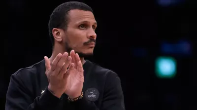 Boston Celtics head coach Joe Mazzulla applauds during the first half of Game 2 of a first-round NBA playoffs basketball series against the Philadelphia 76ers, Tuesday, April 21, 2026, in Boston. (AP Photo/Charles Krupa)