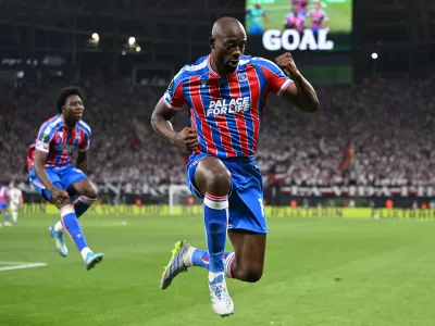 Crystal Palace's Jean-Philippe Mateta celebrates after scoring during the Europa Conference League final soccer match between Crystal Palace and Rayo Vallecano in Leipzig, Germany, Wednesday, May 27, 2026. (Robert Michael/dpa via AP)