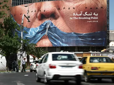 People drive past an anti-U.S. billboard depicting U.S. President Donald Trump and the Strait of Hormuz, in Tehran, Iran, May 26, 2026. Majid Asgaripour/WANA (West Asia News Agency) via REUTERS ATTENTION EDITORS - THIS PICTURE WAS PROVIDED BY A THIRD PARTY
