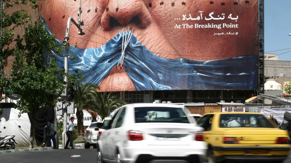People drive past an anti-U.S. billboard depicting U.S. President Donald Trump and the Strait of Hormuz, in Tehran, Iran, May 26, 2026. Majid Asgaripour/WANA (West Asia News Agency) via REUTERS ATTENTION EDITORS - THIS PICTURE WAS PROVIDED BY A THIRD PARTY
