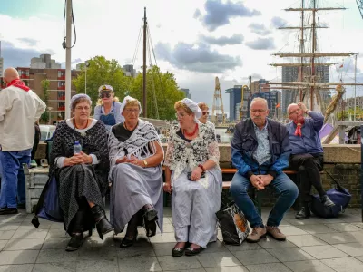Rotterdam, the Netherlands - September 8, 2019: Women in traditional Dutch clothes in the Leuvehaven during the celebration of the World Port Days