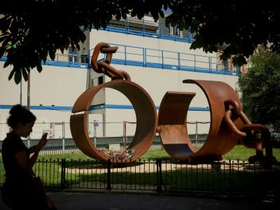 A statue named "Chains," by French artist Driss Sans-Arcidet, honoring the memory of the abolition of slavery, is photographed in a park in Paris, Wednesday, May 27, 2026, as France's National Assembly examines a bill to formally repeal the Code Noir, or Black Code, the 17th-century royal edict that governed slavery in French colonies and treated enslaved people as property. (AP Photo/Thomas Padilla)