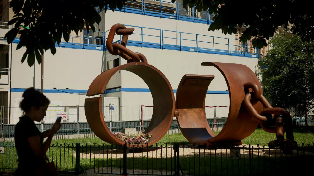 A statue named "Chains," by French artist Driss Sans-Arcidet, honoring the memory of the abolition of slavery, is photographed in a park in Paris, Wednesday, May 27, 2026, as France's National Assembly examines a bill to formally repeal the Code Noir, or Black Code, the 17th-century royal edict that governed slavery in French colonies and treated enslaved people as property. (AP Photo/Thomas Padilla)