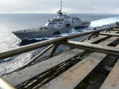 150428-N-GZ947-004 PACIFIC OCEAN (April 28, 2015) - USS Freedom (LCS 1), USS Stockdale (DDG 106) and USS John C. Stennis (CVN 74) participate in a group sail exercise. U.S. Navy ships are underway conducting an Independent Deployer Certification Exercise off the coast of Southern California. The exercise provides a multi-ship environment to train and certify independent deployers in surface warfare, air defense, maritime-interception operations, command and control/information warfare, command, control, computers and combat systems intelligence and mine warfare. (U.S. Navy Photo by Mass Communication Specialist Seaman Kenneth Rodriguez Santiago / Released) USS John C. Stennis operations 150428-N-GZ947-004,Image: 318771485, License: Rights-managed, Restrictions:, Model Release: no 