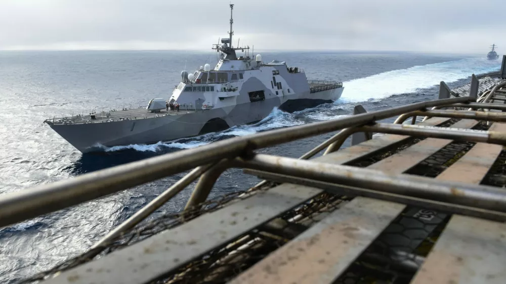 150428-N-GZ947-004 PACIFIC OCEAN (April 28, 2015) - USS Freedom (LCS 1), USS Stockdale (DDG 106) and USS John C. Stennis (CVN 74) participate in a group sail exercise. U.S. Navy ships are underway conducting an Independent Deployer Certification Exercise off the coast of Southern California. The exercise provides a multi-ship environment to train and certify independent deployers in surface warfare, air defense, maritime-interception operations, command and control/information warfare, command, control, computers and combat systems intelligence and mine warfare. (U.S. Navy Photo by Mass Communication Specialist Seaman Kenneth Rodriguez Santiago / Released) USS John C. Stennis operations 150428-N-GZ947-004,Image: 318771485, License: Rights-managed, Restrictions:, Model Release: no 