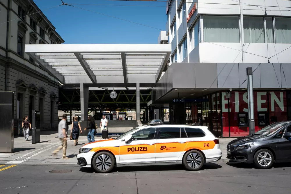 A police vehicle is parked in front of Winterthur train station following a stabbing attack in Winterthur, Switzerland, Thursday, May 28, 2026. (Claudio Thoma/Keystone via AP)