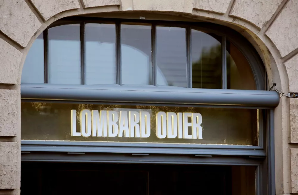 FILE PHOTO: The logo of private bank Lombard Odier (LODH) is seen at a branch office in Zurich, Switzerland August 12, 2019. REUTERS/Arnd Wiegmann/File Photo
