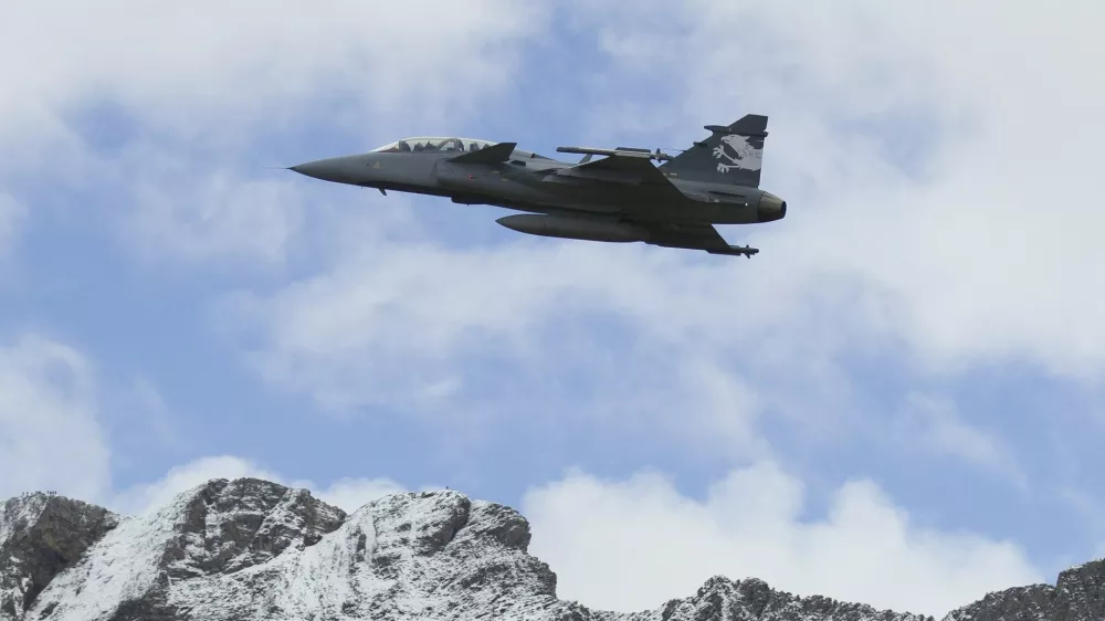FILE --- In this Oct 11, 2012 file picture a Saab Jas Gripen F Demonstrator jet performs during a flight show of the Swiss air force in Axalp near Meiringen, Switzerland. Swiss voters vote on the purchase of 22 Swedish fighter planes for Switzerland's air force on Sunday, May 18, 2014. (AP Photo/Keystone,Peter Klaunzer)
