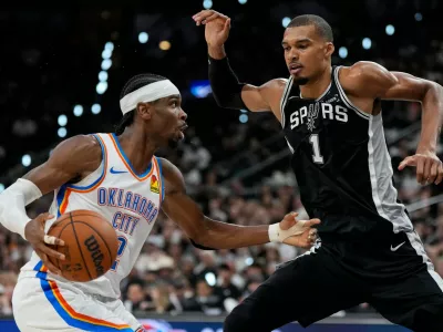 Oklahoma City Thunder guard Shai Gilgeous-Alexander (2) drives against San Antonio Spurs forward Victor Wembanyama (1) in the second half of Game 6 in the Western Conference finals NBA basketball playoffs series, Thursday, May 28, 2026, in San Antonio. (AP Photo/David J. Phillip)