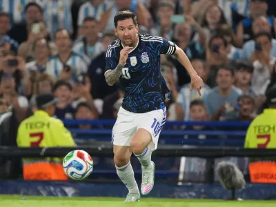 FILE - Argentina's Lionel Messi dribbles during a friendly soccer match against Zambia in Buenos Aires, Argentina, Tuesday, March 31, 2026. (AP Photo/Gustavo Garello, File)